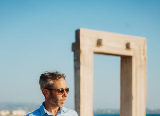Naxos for Solo Travellers Over 40: The Greek Island That Rewards Going Alone Adam, The Luxury Storyteller, at the Temple of Apollo Portara, Naxos, Greece
