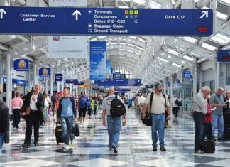 Why do travellers have to walk exhausting distances in airports?