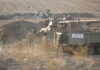 Israel strikes airports in Syria and retrieves some hostages’ bodies as it prepares to invade Gaza