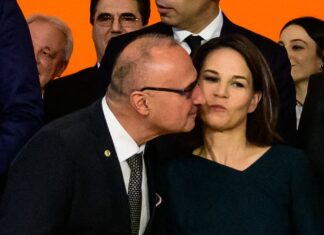 Croatian foreign minister sparks controversy after he tried to kiss his German counterpart while posing for a group photograph in Berlin