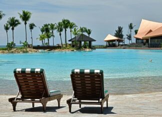 Luxury Hospitality in The Empire Brunei The Empire Brunei against the backdrop of the South China Sea, reflecting opulent luxury with marble and gold interiors