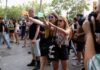 Barcelona anti-tourism protesters spray visitors with water guns